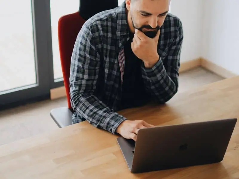 Man looking at computer_AutoRABIT