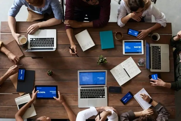 Discussion around table with computers_AutoRABIT